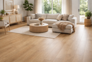 Amberwood 9mm waterproof luxury vinyl plank flooring installed in a modern living room with a beige sectional sofa, wooden coffee table, and decorative plants.