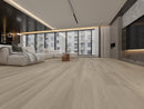 Nordic Oak 9mm LVP installed in a modern living room with wooden flooring, gray walls, and large windows.